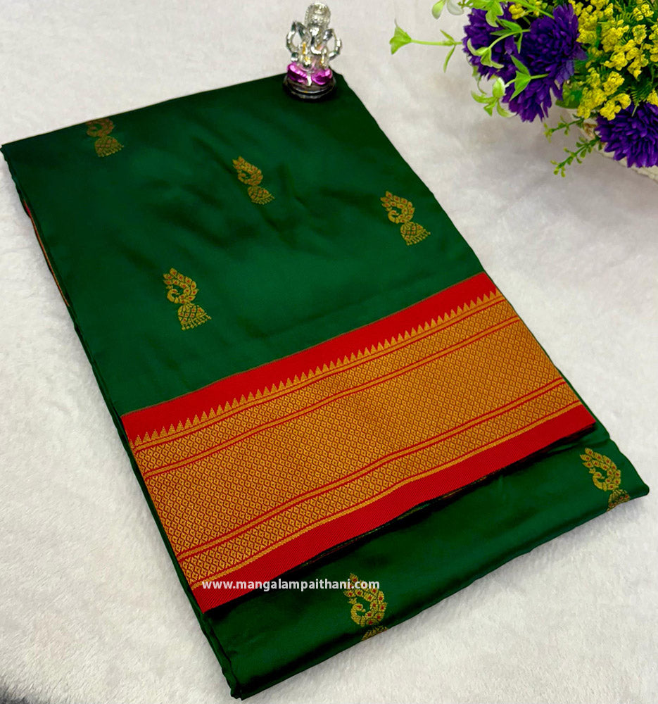 A traditional Paithani saree with a green and red color scheme