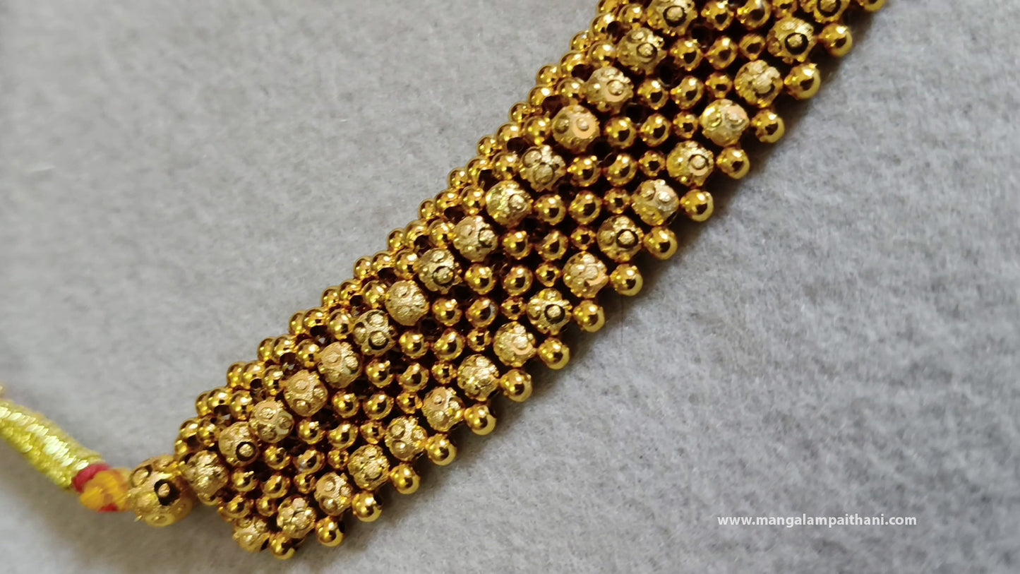 A gold-plated choker necklace set with a red and white floral design, including a necklace and a pair of earrings