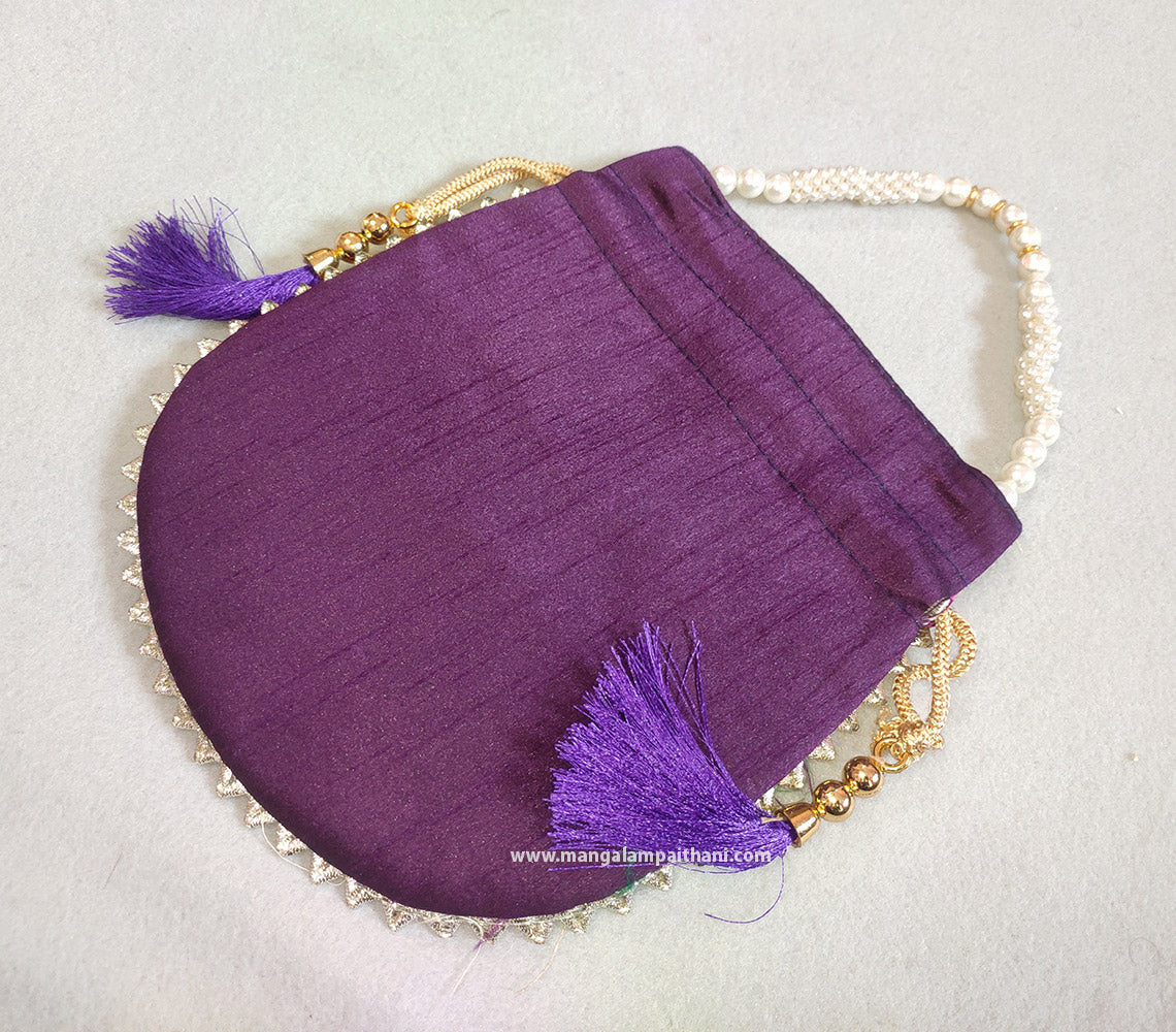 A multicolored designer women's clutch purse