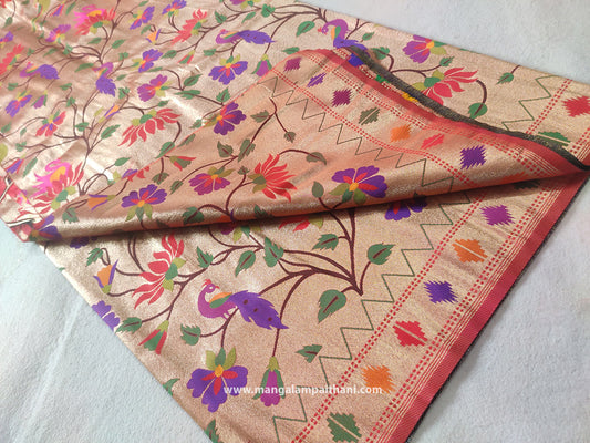 A piece of Paithani fabric with a golden zari