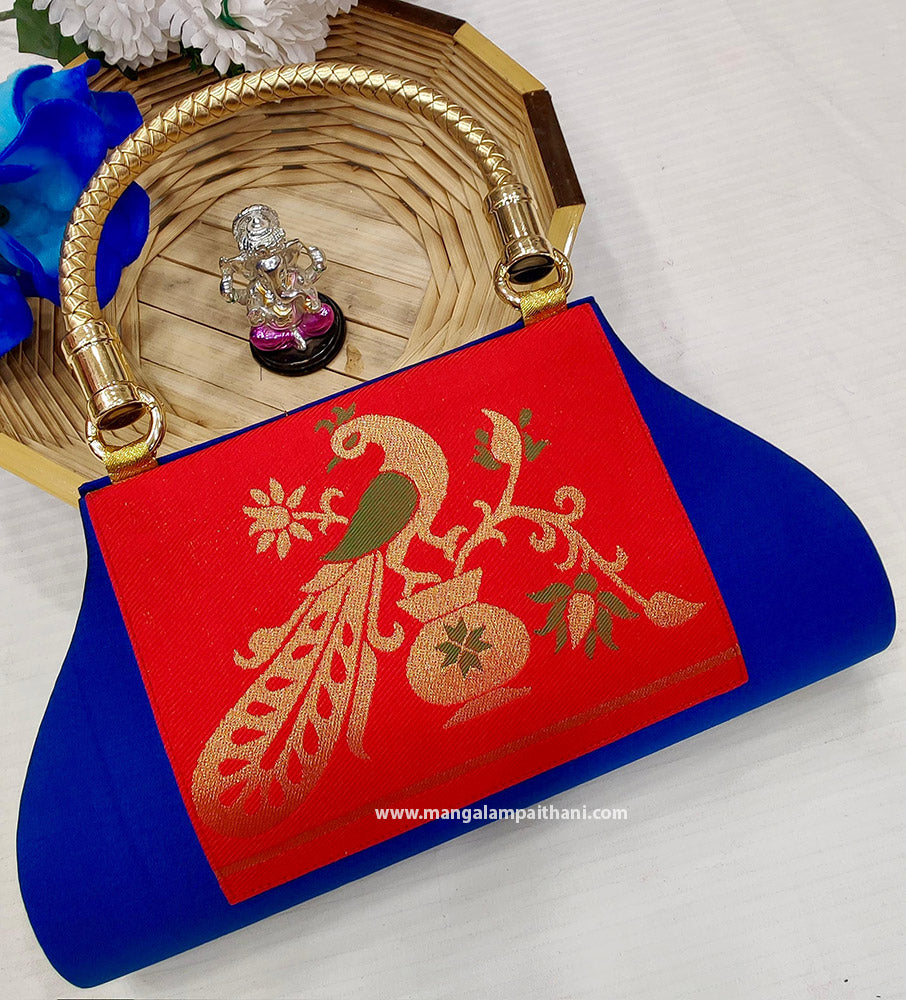 A purple and gold Mangalam Paithani clutch purse