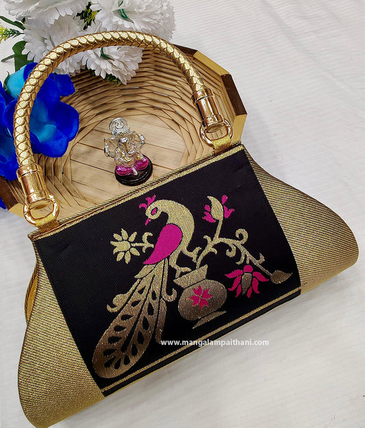 A black and gold clutch purse