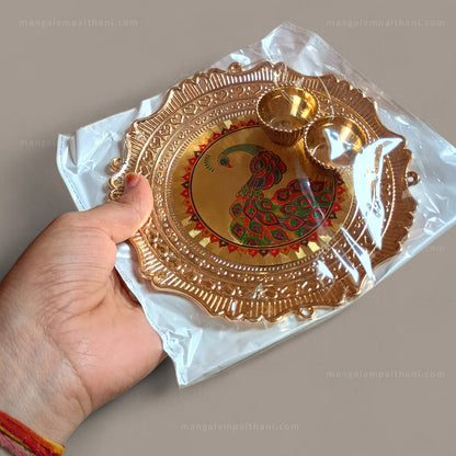 Decorative gold plate with peacock design, mangalam paithani